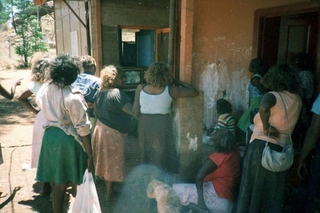Ernabella community members watching local video production. Rex Guthrie c 1983